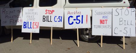 Some of the signs being used to demonstrate opposition to Bill C-51 in Sudbury today. (Photo by Scott Neigh)