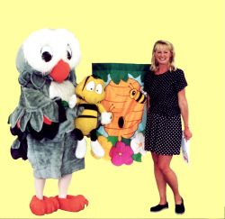 Cindy Cook of *Time to Read* and *Polka Dot Door* with "Owlie." They will be part of the extensive programming for children and families at this year's Northern Lights Festival Boreal.