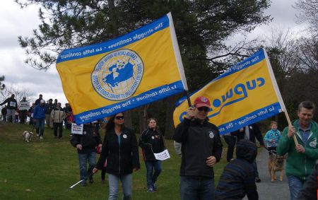 Beautiful yellow and blue flags were carried during the "walking for our postal carriers" event.