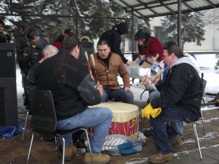 The N'Swakamok Native Friendship Centre drumming group doing an opening song at the Solidarity Against Austerity action in Memorial Park. (Photo by Scott Neigh)