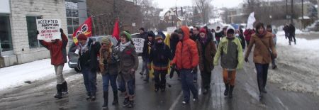 Demonstrators take to the streets of downtown Sudbury during the Solidarity Against Austerity event. (Photo by Scott Neigh)
