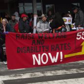 Along with the specific focus on disability benefits, the rally and march continued to present the demand that social assistance rates be restored to the same purchasing power they had in 1995, which would take a 55% increase. (Photo by Scott Neigh)