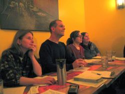 This photo shows the panel at the Dec. 3 "Challenge the City!" forum at the Laughing Buddha in Sudbury, Ontario. From left to right are Naomi Grant (Coalition for a Liveable Sudbury), Jamie West (Sudbury and District Labour Council), and Anna Harbulik and Christy Knockleby (Sudbury Coalition Against Poverty). (Photo by Lilly Noble)