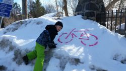 Some Family Day fun discovering bike stencils on snow bank.  Photo Credit:  Ernst Gerhardt